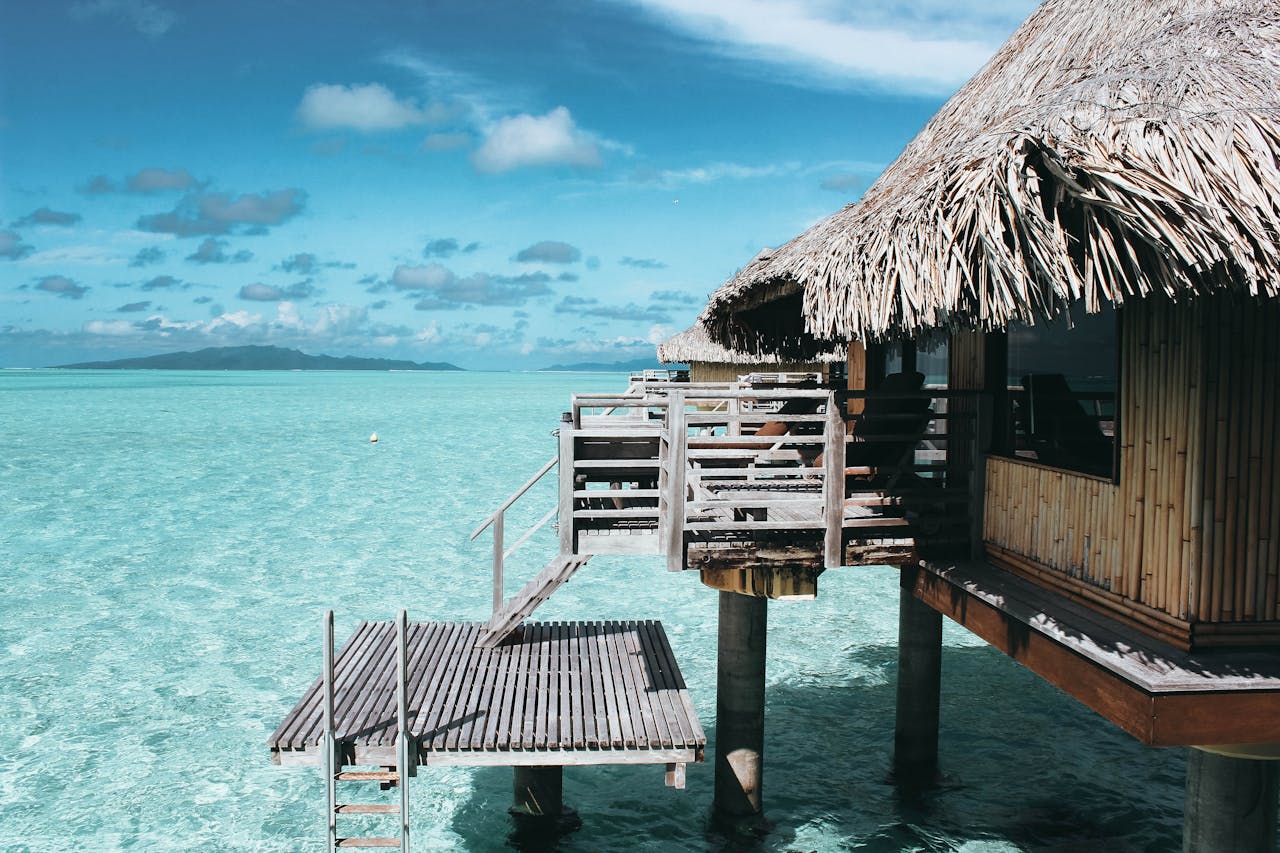 hero-img-01 Scenic overwater bungalow in Vaitāpē, French Polynesia. Perfect tropical escape.